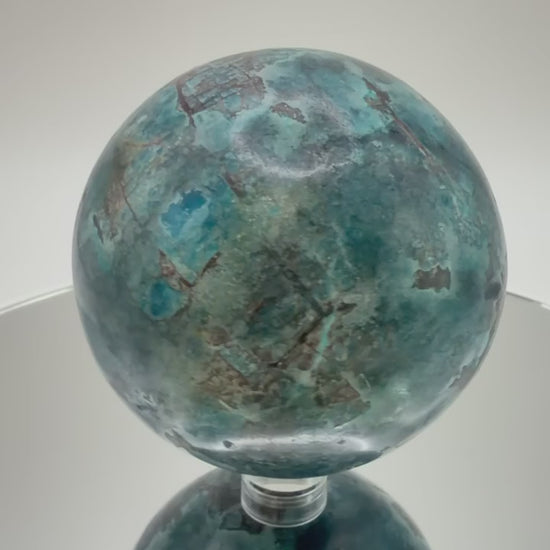 Blue Apatite sphere video showing teal blue color and matrix detail