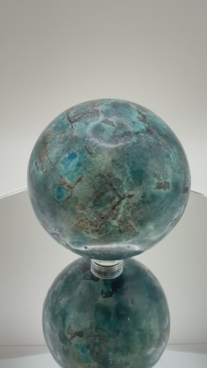 Blue Apatite sphere video showing teal blue color and matrix detail
