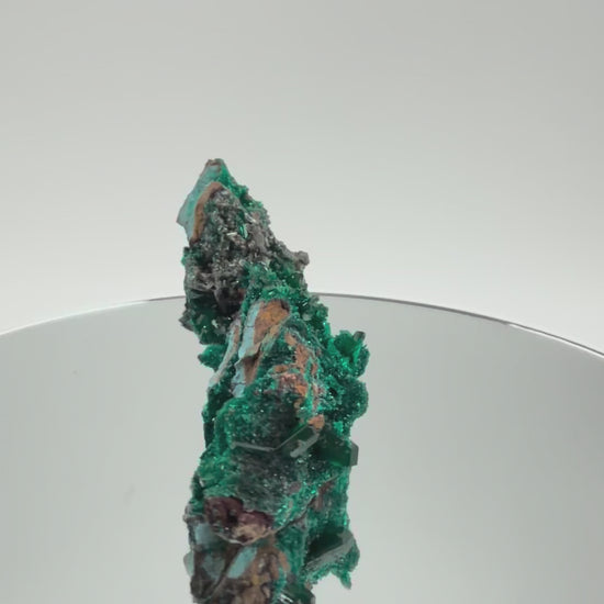 Dioptase specimen turning in the light
