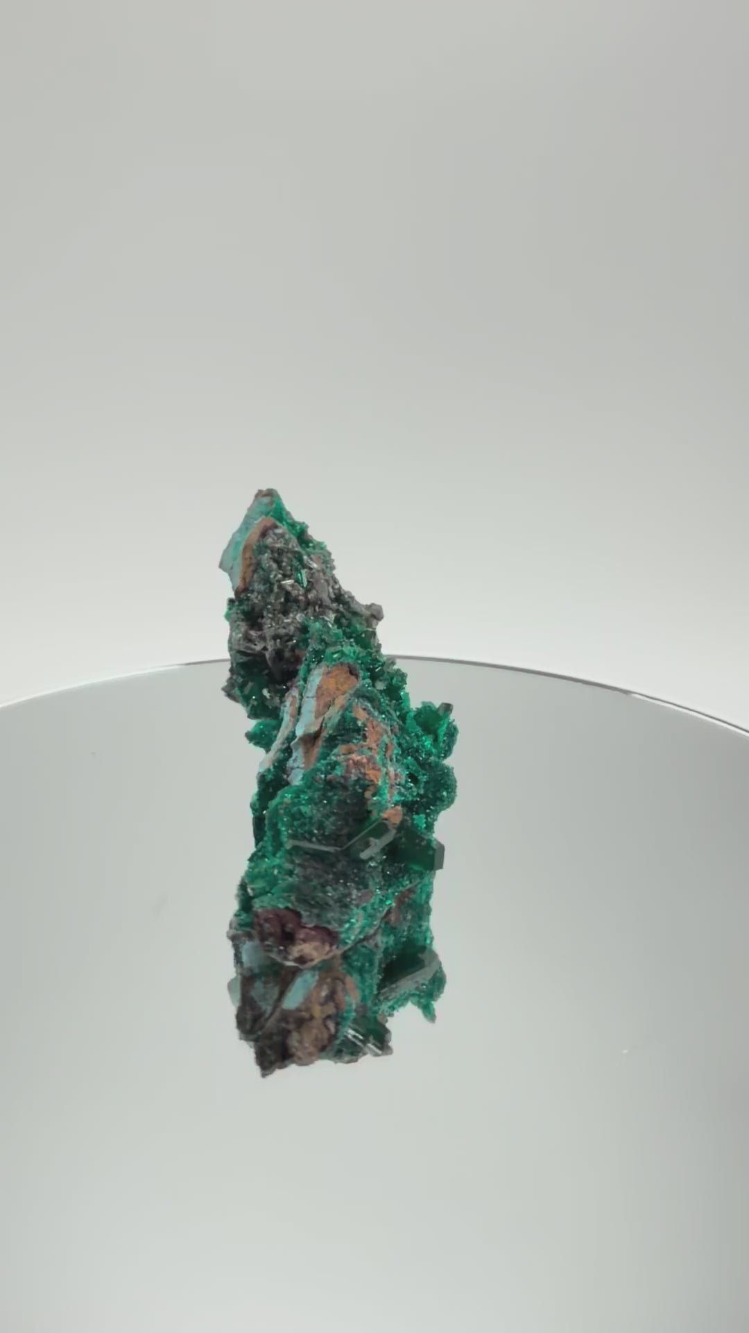 Dioptase specimen turning in the light