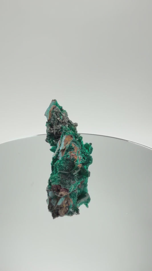 Dioptase specimen turning in the light