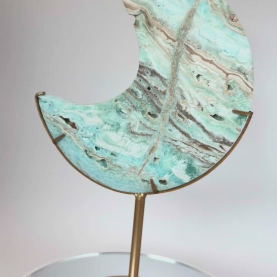 Caribbean calcite moon turning on its stand