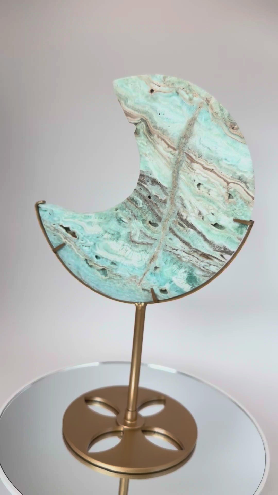 Caribbean calcite moon turning on its stand