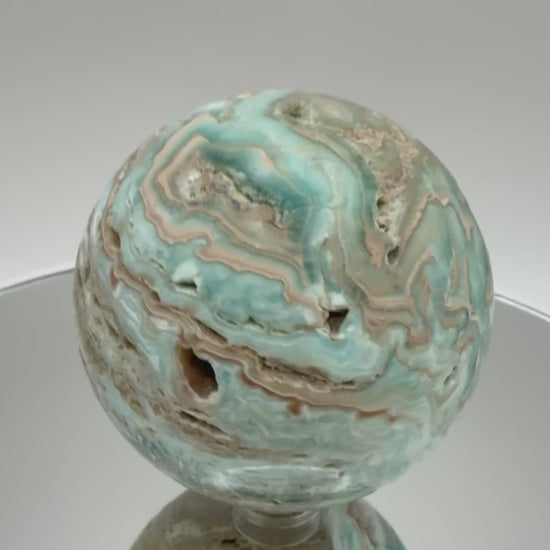 Caribbean calcite sphere video showing blue banding from all angles