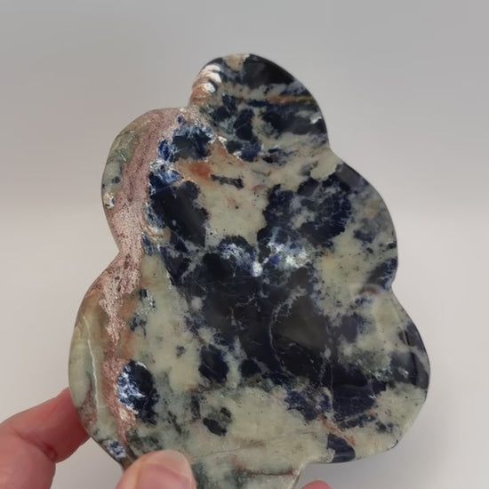 Turning the sunset sodalite cloud dish in hand