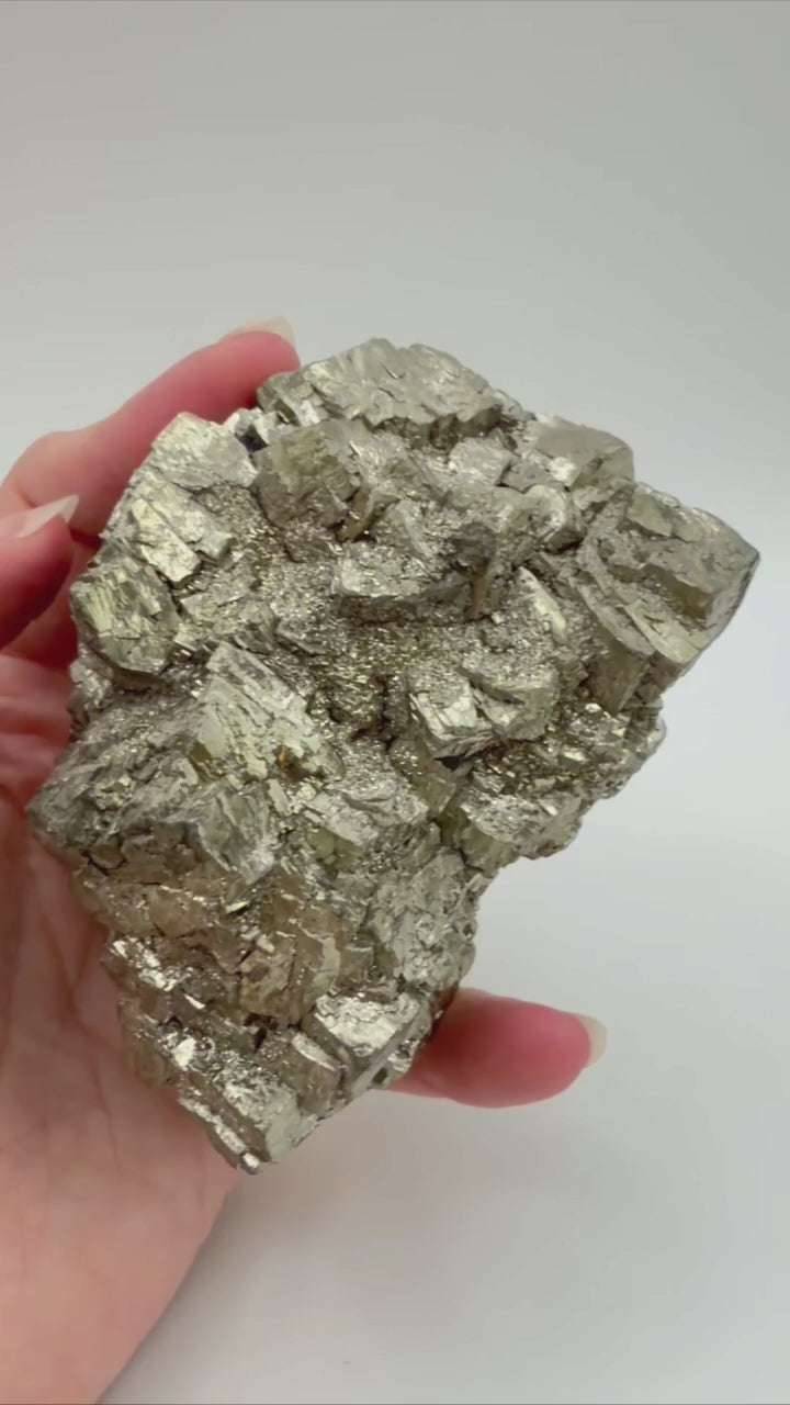 Pyrite crystal cluster video showing metallic luster from multiple angles