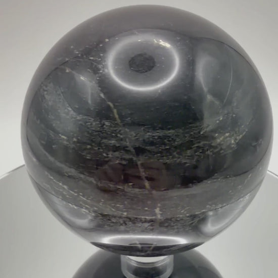 Silver Sheen Obsidian sphere video showing silvery flash and polish