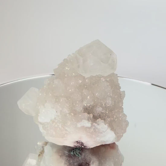 White apophyllite cluster with clear terminated crystal