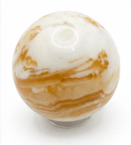Honey calcite sphere showing cream tones
