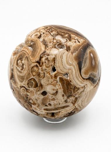Chocolate calcite sphere side view with swirling bands