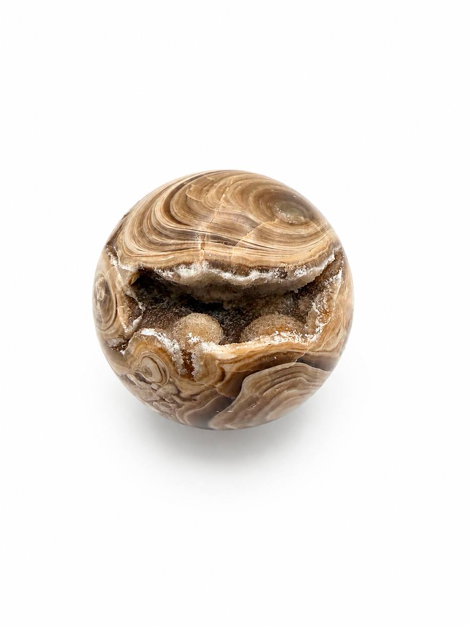 Chocolate calcite sphere top view showing druzy cavity