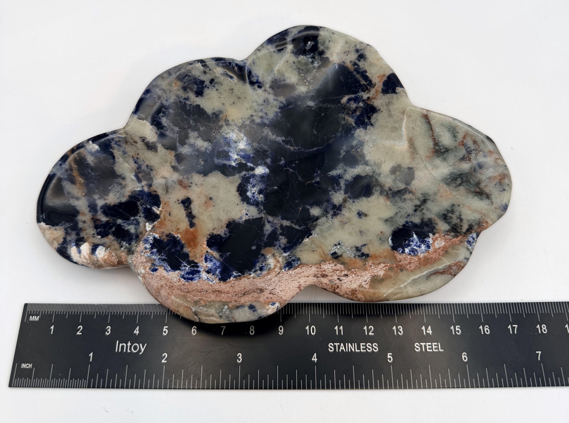 Sodalite cloud dish beside a steel ruler, about 7 inches across
