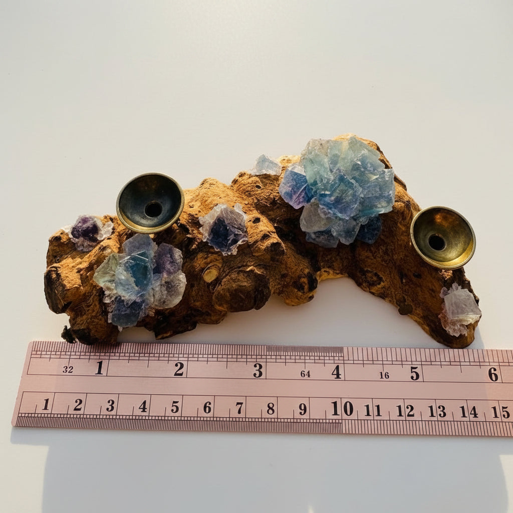 Blue fluorite sphere holder with ruler for size reference