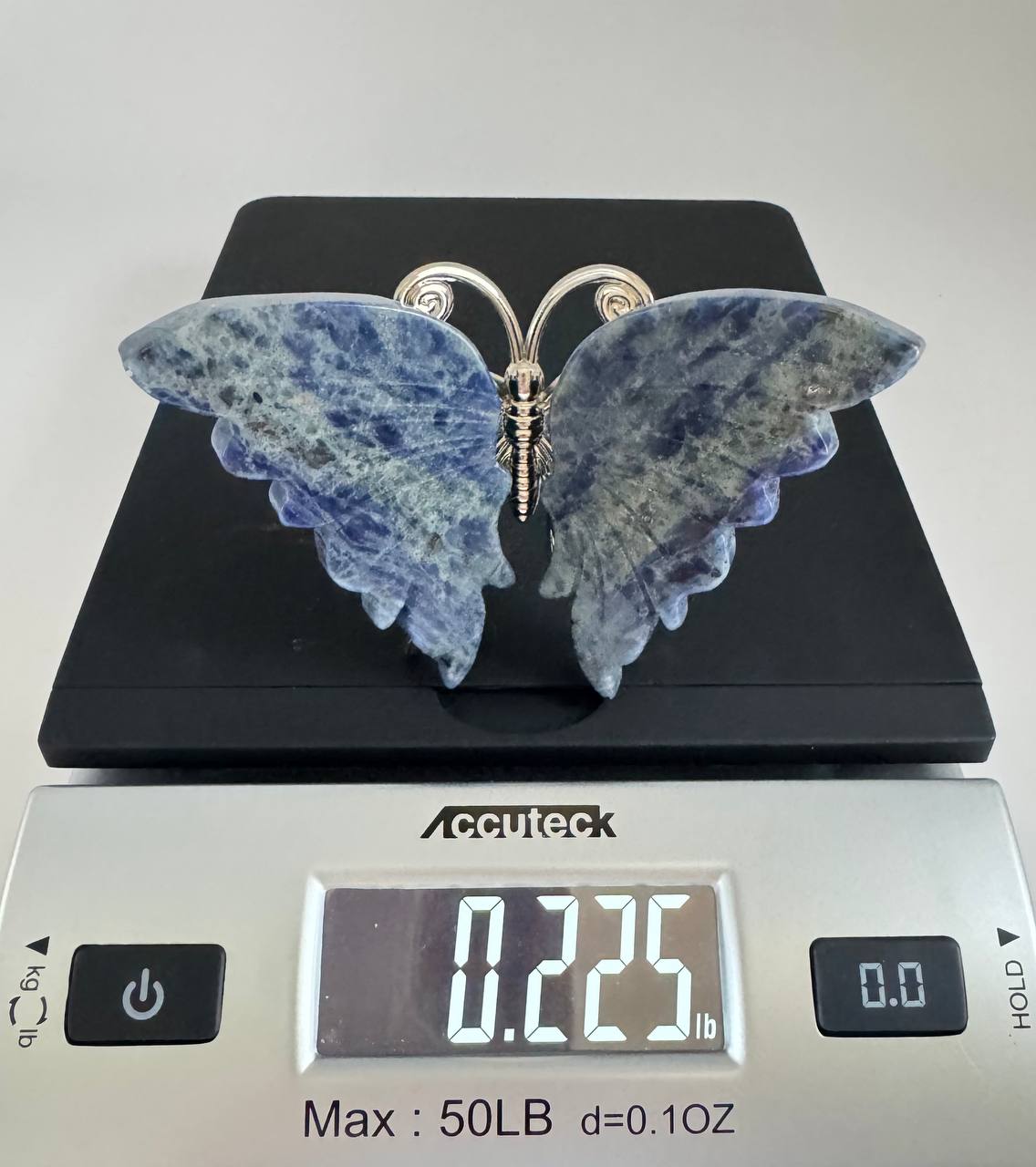 Sodalite butterfly on scale reading 0.225 lbs