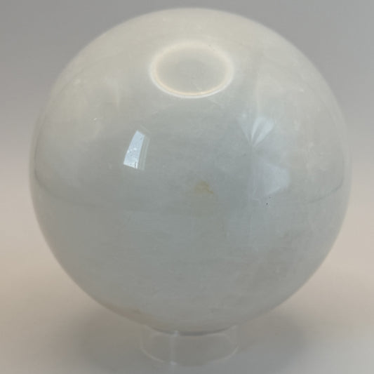 Milky quartz sphere on its clear ring stand