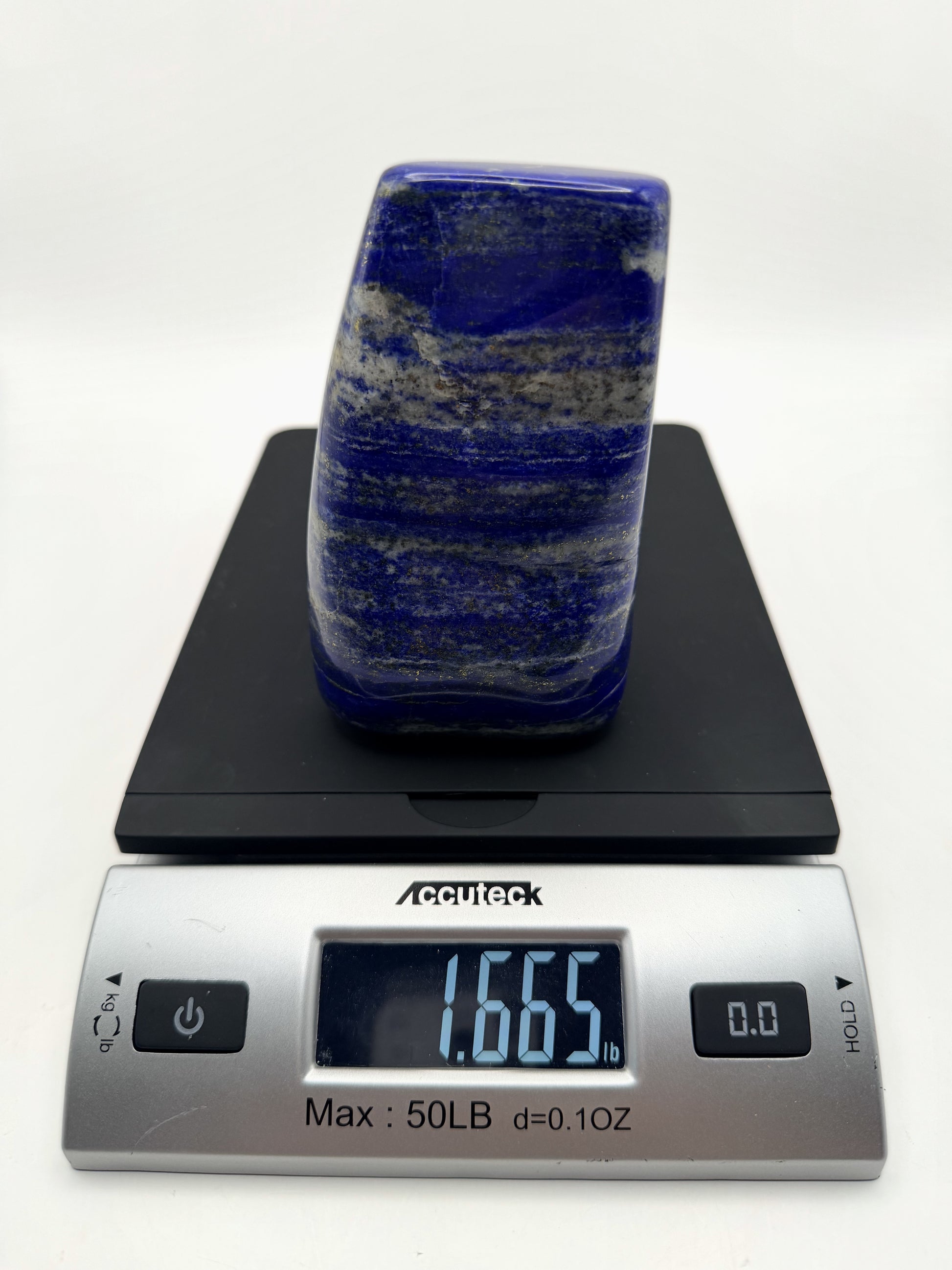 Lapis lazuli freeform on a scale