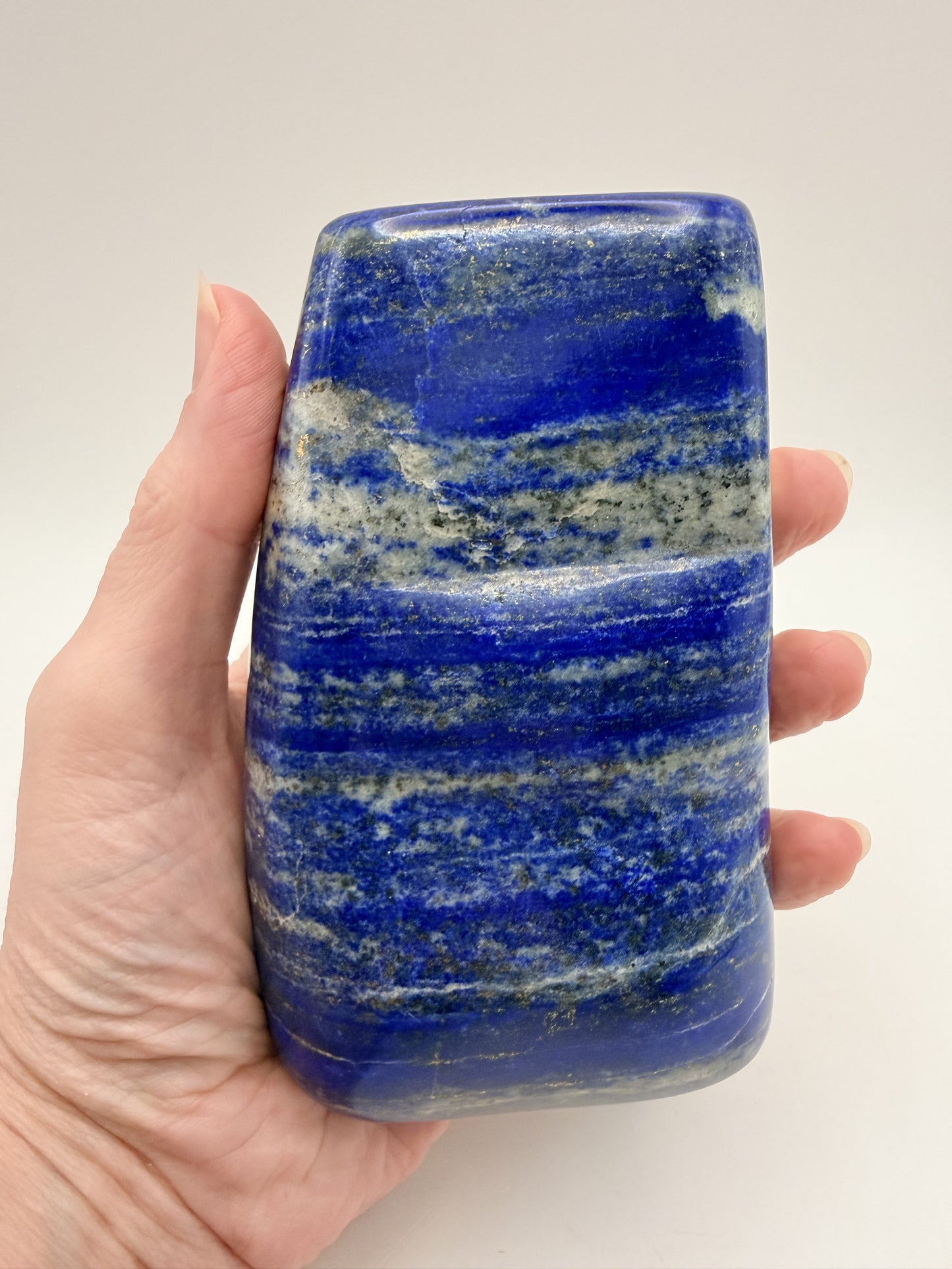 Lapis lazuli freeform held in hand