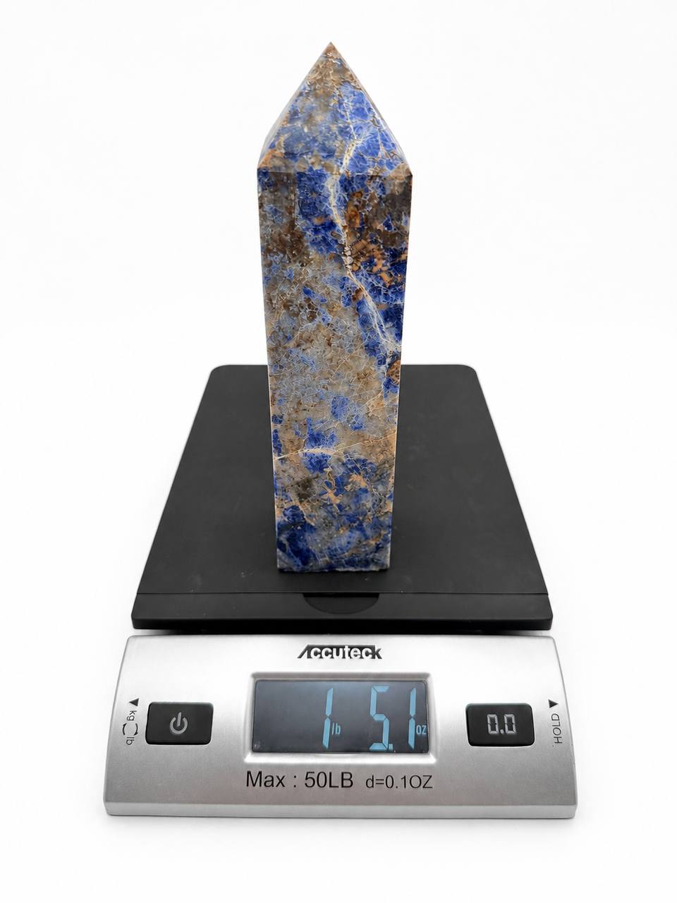 Lapis lazuli tower on scale showing 1 lb 5.1 oz