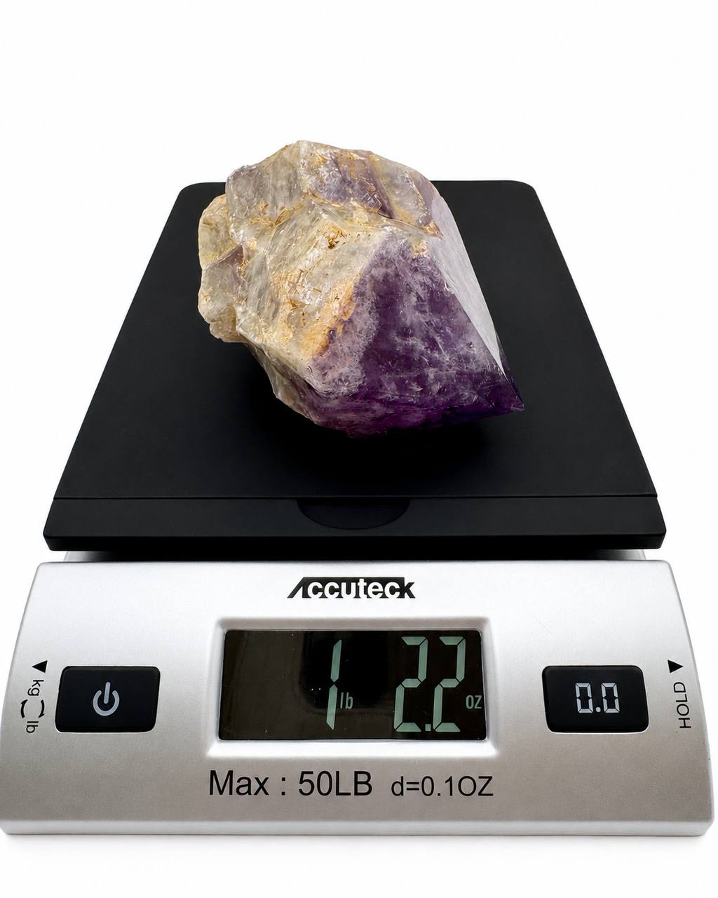 Amethyst chunk on scale showing 1 lb 2.2 oz